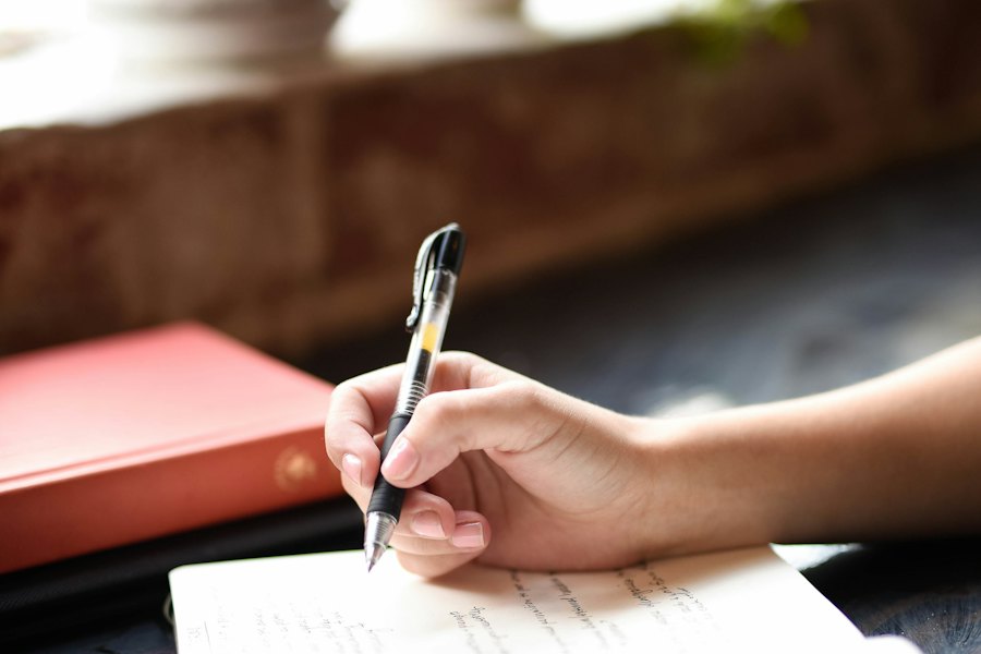 Hand taking notes on a sheet of paper